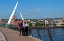 Emma Pollock CTO of FinTrU, Software NI Chief Executive David Crozier, and Chris Clements, Director of Product Development at FinTrU on the Peace Bridge, Derry~Londonderry